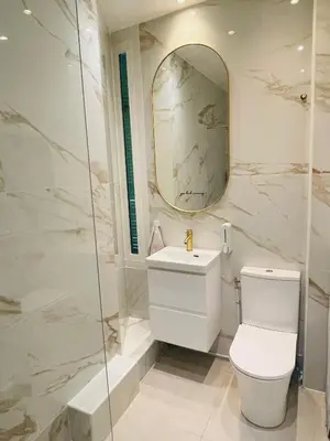 a bathroom with a toilet and a sink and a mirror at Studio récemment rénové proche gare et ville in Nice