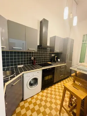 a kitchen with a washing machine in the middle at Studio récemment rénové proche gare et ville in Nice