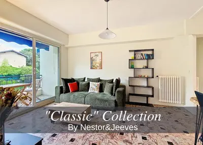 a living room with a couch and a window at Nestor&Jeeves - SOLAR - By sea - Balcony in Nice