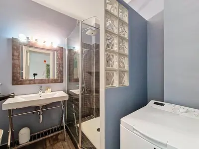 a bathroom with a sink and a glass shower at Nestor&Jeeves - SOLAR - By sea - Balcony in Nice