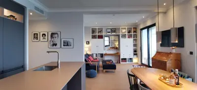 a kitchen and living room with a table in a room at Exceptional brand new flat, 20 m from beach, 85 sq in Nice