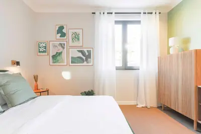 a bedroom with a white bed and a window at Exceptional brand new flat, 20 m from beach, 85 sq in Nice
