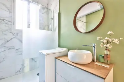 a bathroom with a sink and a mirror at Magnificent apartment - Carré d'or in Nice