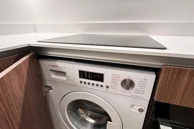 a washing machine in a kitchen with a counter at OPERA PROMENADE 2 Renovated 1 min to Beach Air Conditioning in Nice