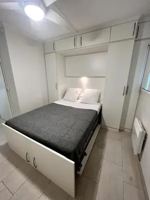 a bedroom with a bed in a small room at Casa Alessia - Villefranche-sur-mer in Villefranche-sur-Mer