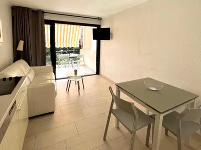 a living room with a couch and a table at Casa Alessia - Villefranche-sur-mer in Villefranche-sur-Mer