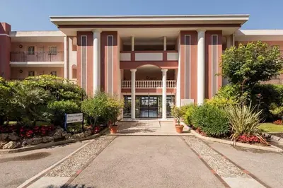 a large building with a walkway in front of it at Casa Alessia - Villefranche-sur-mer in Villefranche-sur-Mer
