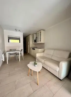 a living room with a couch and a table at Casa Alessia - Villefranche-sur-mer in Villefranche-sur-Mer