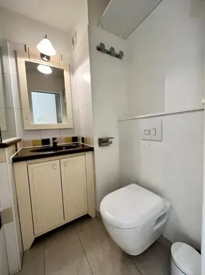 a bathroom with a white toilet and a sink at Casa Alessia - Villefranche-sur-mer in Villefranche-sur-Mer