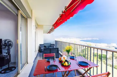 a balcony with a table with fruit on it at LE SIRIUS AP4314 By Riviera Holiday Homes in Nice