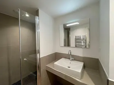 a bathroom with a sink and a shower at Homelivia,Industriel cosy in Nice