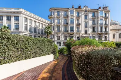 a street in front of a large building at MY CASA - JOFFRE 2 - Cosy apartment in City Center in Nice