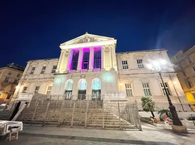 a building with pink lights on top of it at Homelivia, VIEUX NICE, appartement de charme, clim balcon in Nice