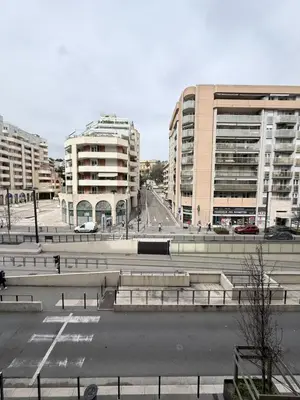 a view of a city with buildings and a street at Studio central avec balcon- Plage - Tram - Aéroport in Nice