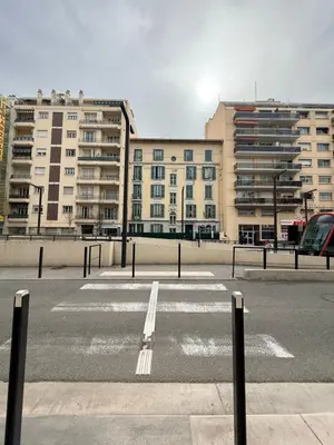 an empty parking lot with buildings in the background at Studio central avec balcon- Plage - Tram - Aéroport in Nice