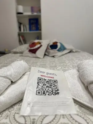 a book sitting on top of a bed with towels at Cosy studio VIEUX NICE à 2 pas de la MER in Nice