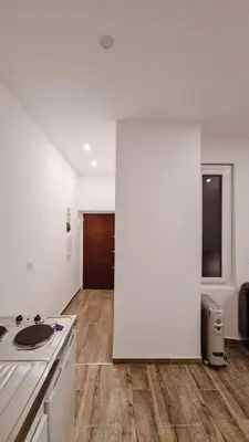 a kitchen with white walls and a counter top at Cosy studio VIEUX NICE à 2 pas de la MER in Nice