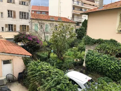 a white car parked in the yard of a building at Nice Libération in Nice