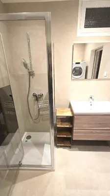 a bathroom with a shower and a sink at 