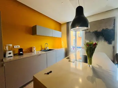 a kitchen with a vase of flowers on a counter at Bonaparte - Nice in Nice