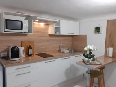 a living room with a bed and a table at Studio neuf centre ville Quartier Libération in Nice