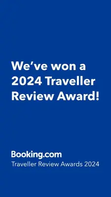 a blue sign that says weve won a traveler review award at Studio Nice Le Palais, avec cuisine et espace repas séparés, dans immeuble niçois, Port de Nice, Vieux Nice, Place du pin et Garibaldi, Colline du château, à 2 minutes de la promenade des Anglais in Nice