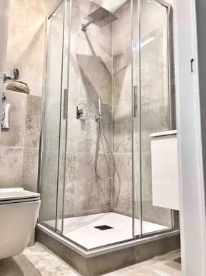 a shower with a glass door in a bathroom at Homelivia, Votre Appartement ideal pour découvrir Nice in Nice