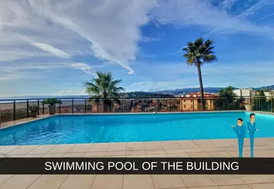 a man and woman standing next to a swimming pool at Nestor&Jeeves - GRAND SUD TERRASSE - Pool - Free parking in Nice