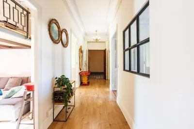 a hallway with a couch and a mirror on the wall at LE PALAZZO AP4329 By Riviera Holiday Homes in Nice