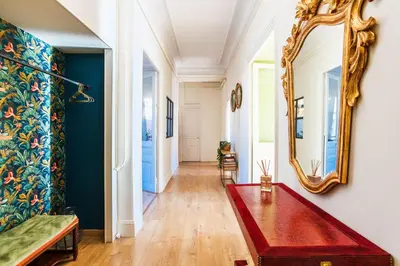 a living room with a red bench and a mirror at LE PALAZZO AP4329 By Riviera Holiday Homes in Nice