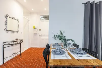 a dining room with a table and chairs at Lovely 1 Bdr in Harbor Area in Nice