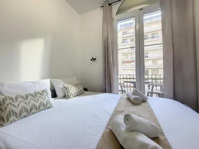 a bedroom with two beds and a large window at Nestor&Jeeves - ROSIE FRANCE RIVIERA - Close sea - Balcony in Nice