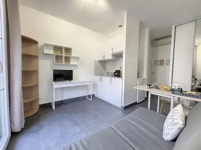 a kitchen with white cabinets and a table in a room at Nestor&Jeeves - ROSIE FRANCE RIVIERA - Close sea - Balcony in Nice