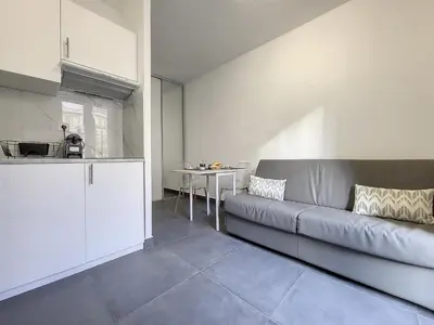 a living room with a couch and a table at Nestor&Jeeves - ROSIE FRANCE RIVIERA - Close sea - Balcony in Nice