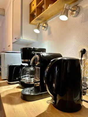 a kitchen counter with two coffee cups on a counter top at Romantique - NeaSpace Vieux Nice in Nice