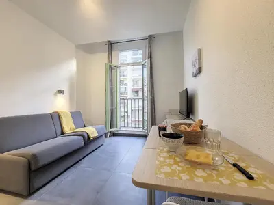 a living room with a couch and a table at Nestor&Jeeves - GOLDIE FRANCE RIVIERA - Very close sea in Nice