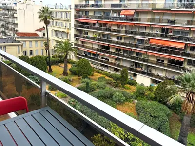 a balcony with a view of a large building at Beachfront Studio on Promenade des Anglais in Nice