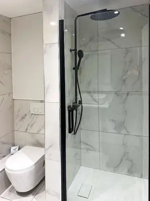 a bathroom with a shower and a toilet at Beachfront Studio on Promenade des Anglais in Nice