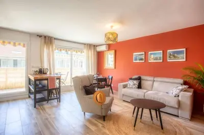 a living room with a couch and a table at #4 Papon Parking climatisé terrasse & wifi 5mins à pieds du Vieux Nice in Nice