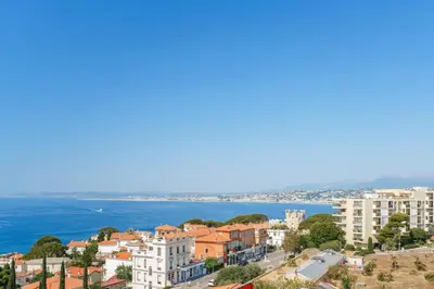 a view of a city and the ocean at Balcon sur la Méditerranée in Nice