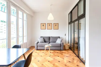 a living room with a couch and a table at #7 What else ? Your own quiet terrace in Nice center 10min to Beach in Nice