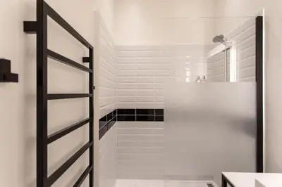 a white bathroom with a shower and a sink at #8 Suite Promenade 1min Beach 2rooms/Parking/Terrace/WIFI in Nice