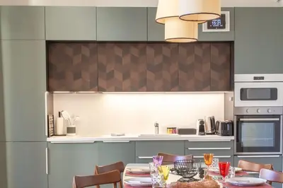 a kitchen with a table and chairs and a kitchen with a counter at #8 Suite Promenade 1min Beach 2rooms/Parking/Terrace/WIFI in Nice
