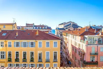 a group of colorful buildings in a city at #9 Opera's Duplex panoramic Sea View Terrace & AC 1min to Beach in Nice