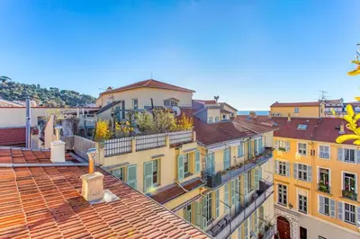 a group of buildings with roofs at #9 Opera's Duplex panoramic Sea View Terrace & AC 1min to Beach in Nice