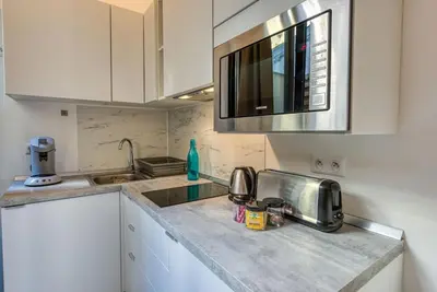 a kitchen with a sink and a microwave at #14 Duplex Tonduti terrace 5min Old Town in Nice