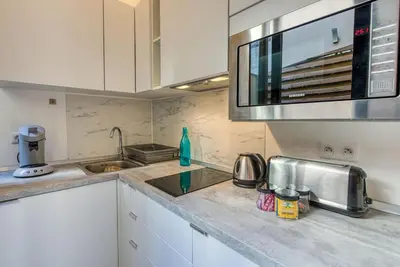 a kitchen with a sink and a microwave at #14 Duplex Tonduti terrace 5min Old Town in Nice