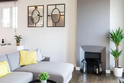 a living room with a couch and a fireplace at #24 Marie-Claire Suite Sea view/balcony/AC/5min port in Villefranche-sur-Mer