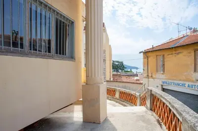 a view from a balcony of a building with a column at #24 Marie-Claire Suite Sea view/balcony/AC/5min port in Villefranche-sur-Mer