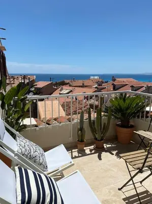 a balcony with chairs and a view of a city at #32 Panoramic Sea View over Old Town Terrace & AC in Nice
